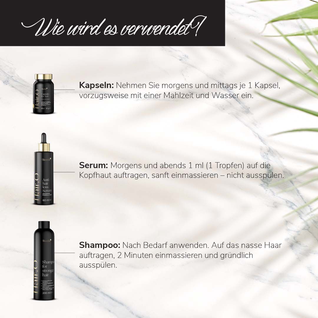 Biostile Hair.O Set: Shampoo, Serum und Kapseln auf einem Holzpodest, umgeben von weißen Blüten.