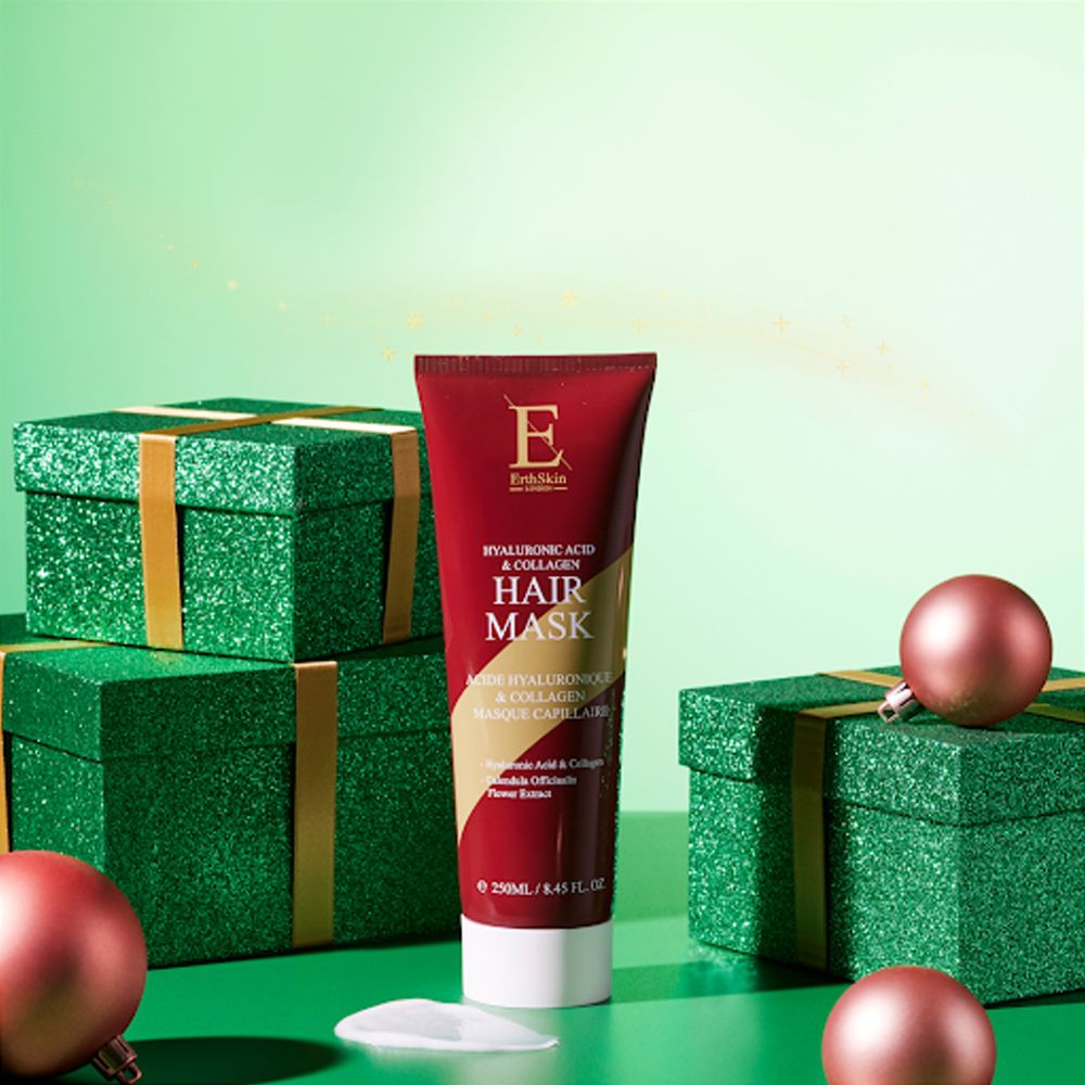 Rote Tube mit Hyaluronsäure & Kollagen Haarmaske, umgeben von grünen Geschenkboxen und rosafarbenen Kugeln.