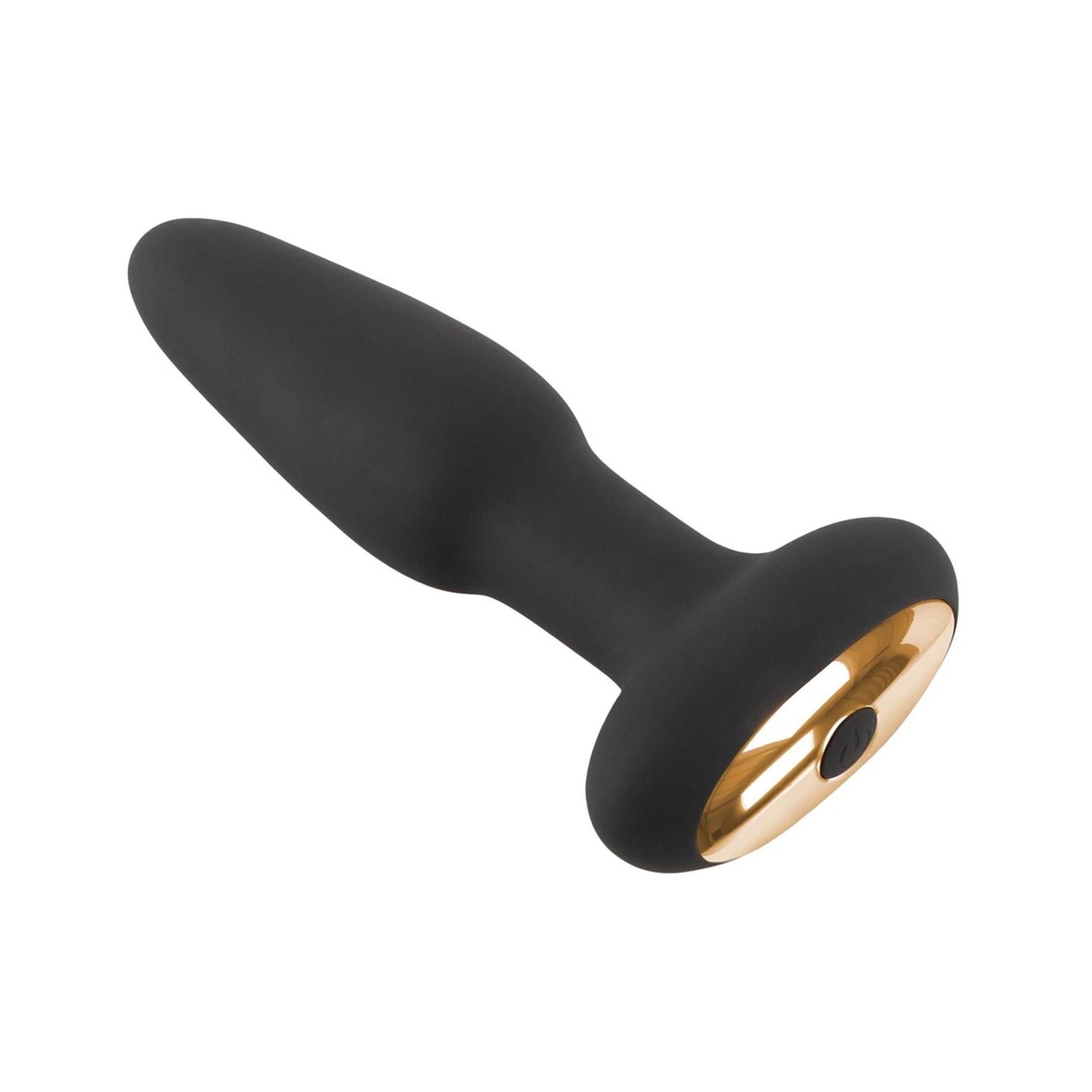 Schwarzer ANOS Pressure Trainer Anal Plug aus Silikon mit goldenem Boden, schräg von der Seite.
