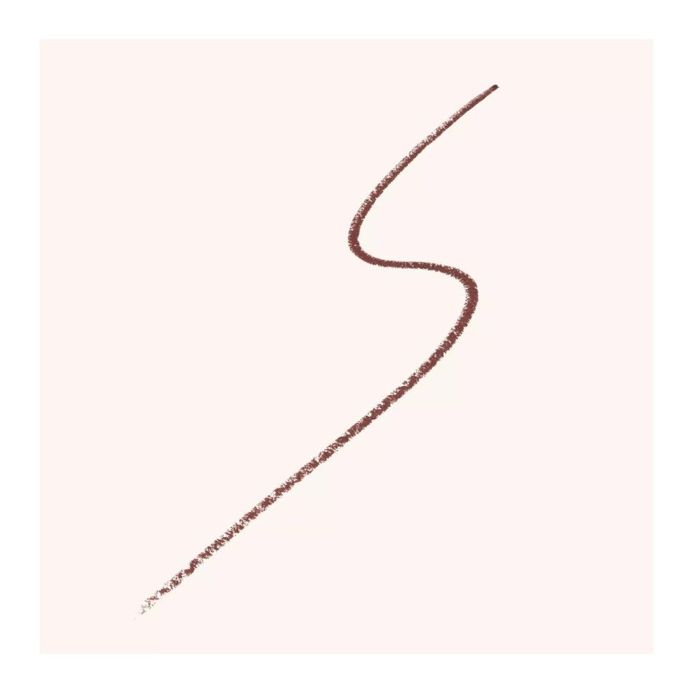 Braune Kajalstift-Linie auf hellem Hintergrund. Die Linie ist geschwungen.