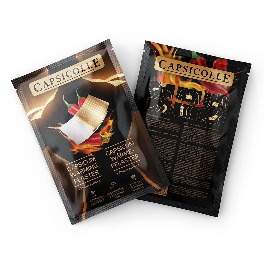 Zwei Capsicolle Wärmepflaster-Packungen. Aufschrift: Capsicum Warming Plaster. EU-Siegel.