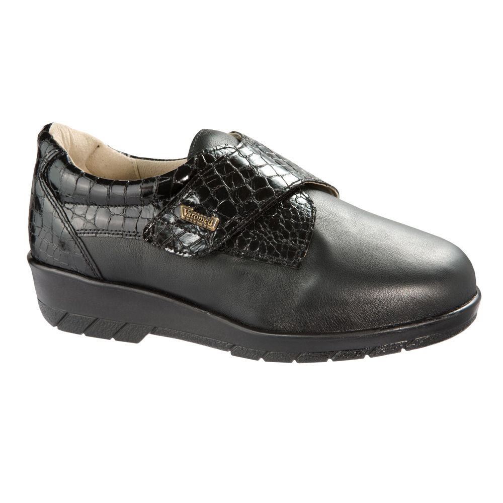 Schwarzer Schuh mit Klettverschluss. Geprägtes Lederdetail. Marke Varomed.