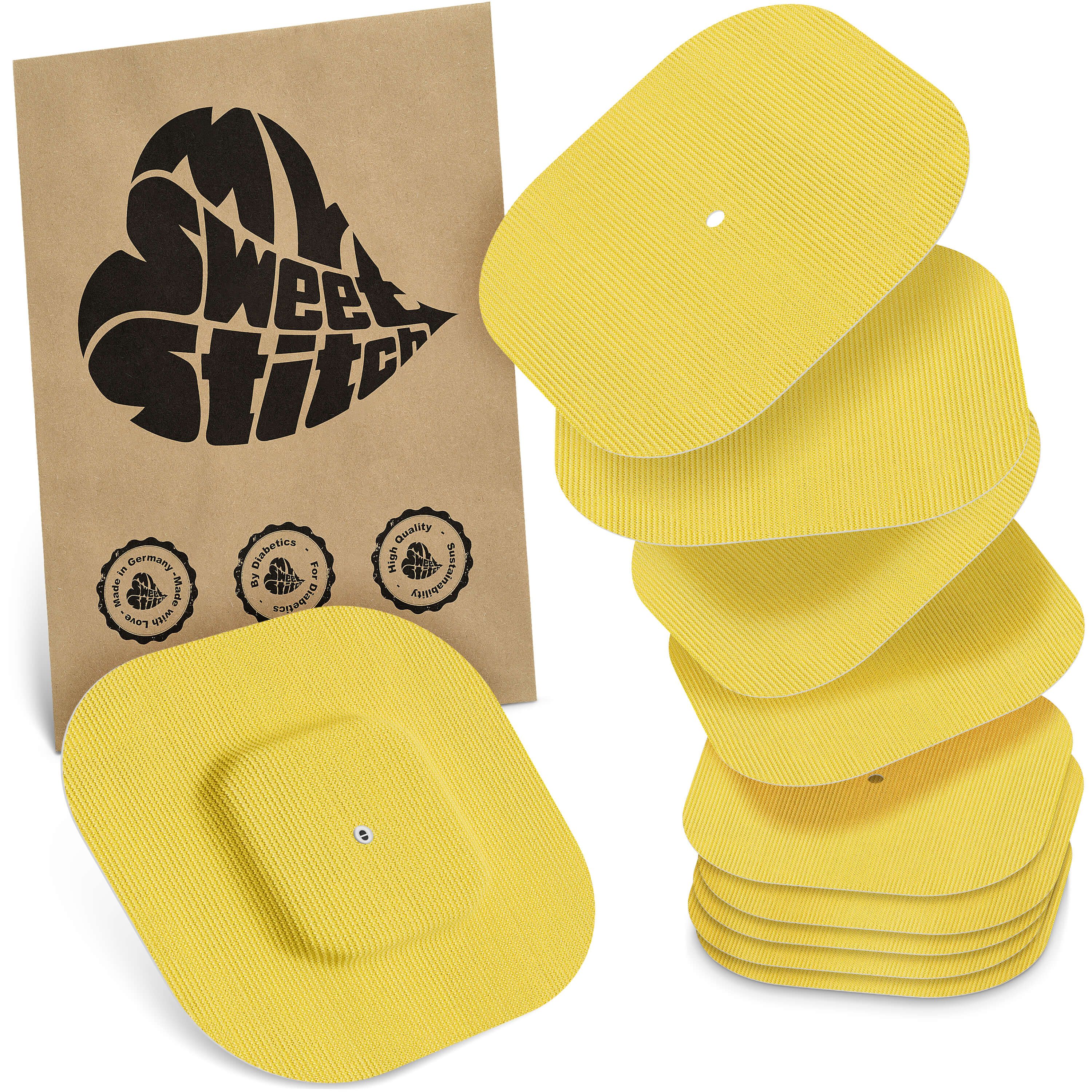 Gelbe, quadratische Pflaster mit abgerundeten Ecken. Verpackung mit Logo "My Sweet Stitch". Siegel: Made in Germany.