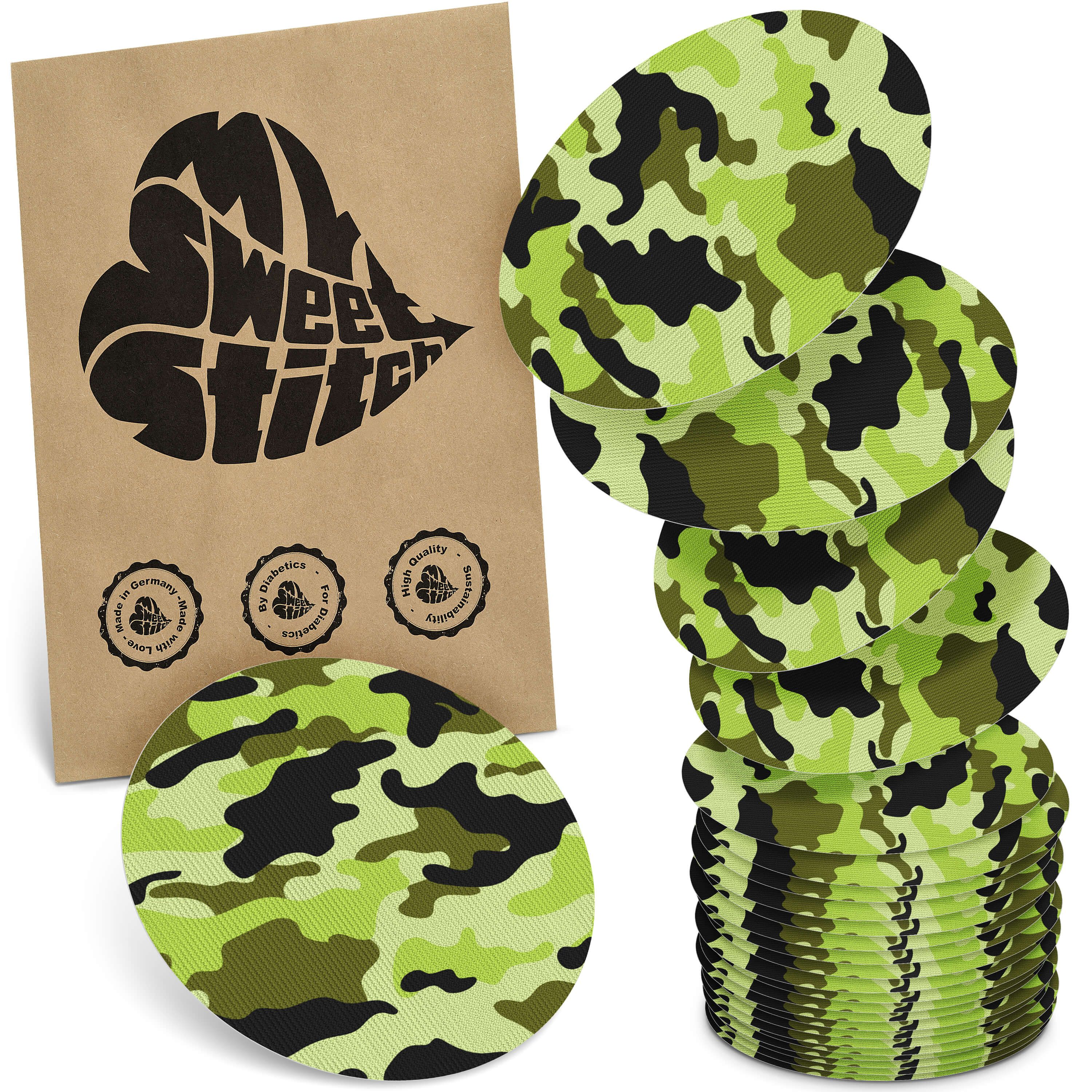 Oval geformte Pflaster mit Camouflage-Muster. Braune Verpackung mit Logo und Qualitätssiegeln.