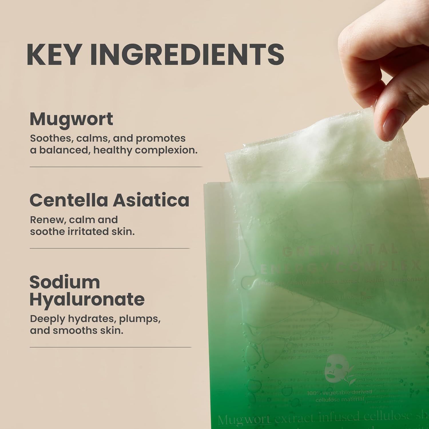 Zutaten: Beifuß, Centella Asiatica, Natriumhyaluronat. Text auf weißem Hintergrund. Hand hält Maske.