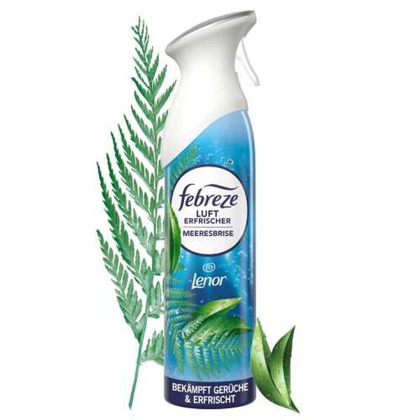 Febreze Lufterfrischer Meeresbrise Sprayflasche mit Sprühkopf, umgeben von Farnblättern.