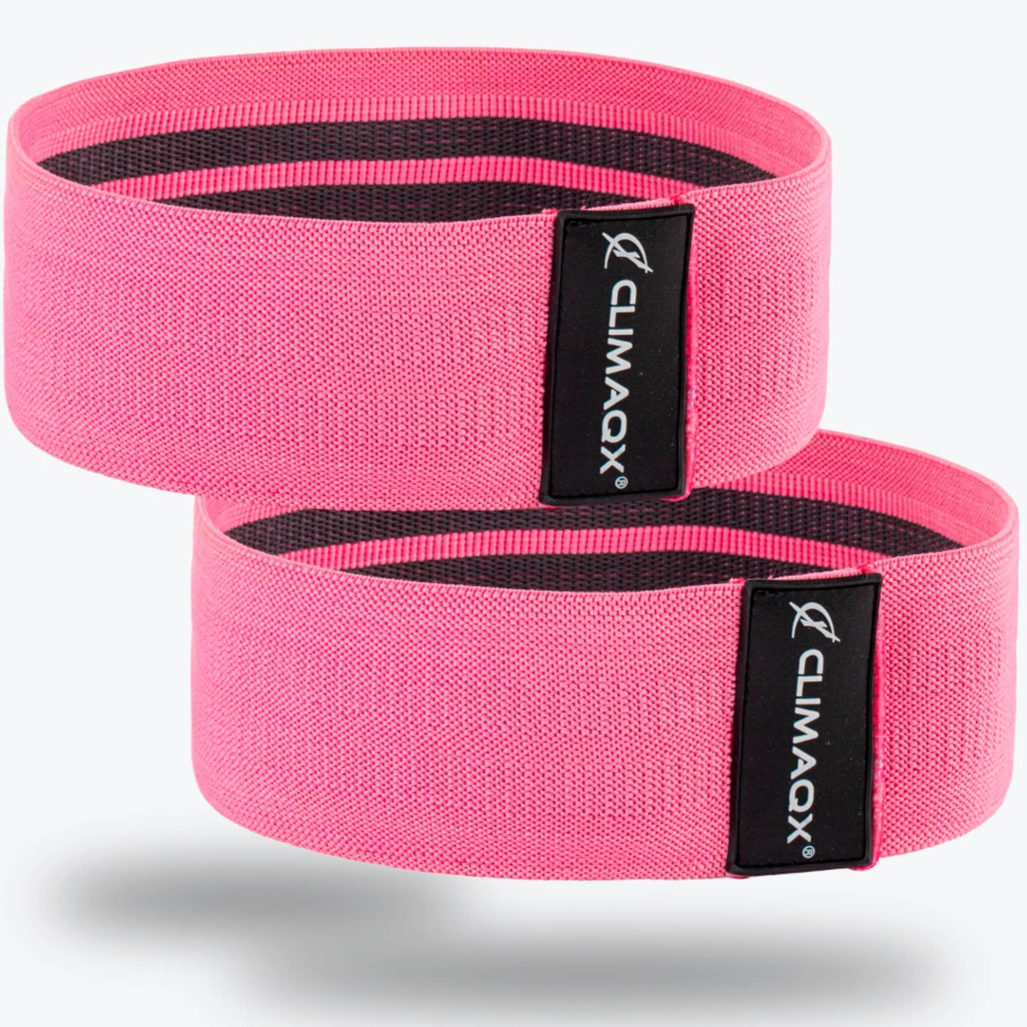 Zwei pinkfarbene CLIMAQX Booty Bands. Schwarzes Logo auf schwarzem Etikett. Elastisches Material.