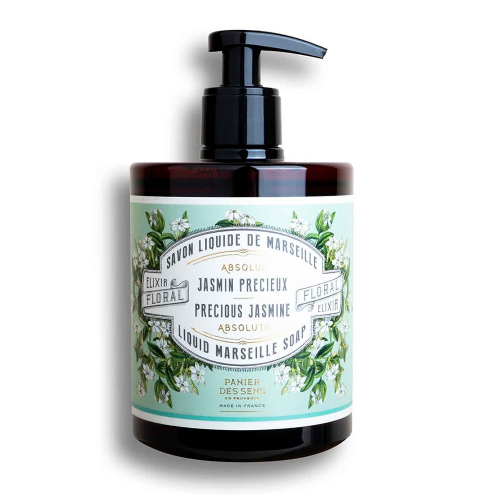 Flüssigseife in brauner Pumpflasche mit Etikett, das Jasminblüten zeigt.