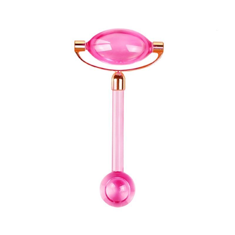 Pinkfarbener Eisroller für das Gesicht. Ovaler Kopf, goldfarbene Halterung, zylindrischer Griff und runder Kopf am Ende.
