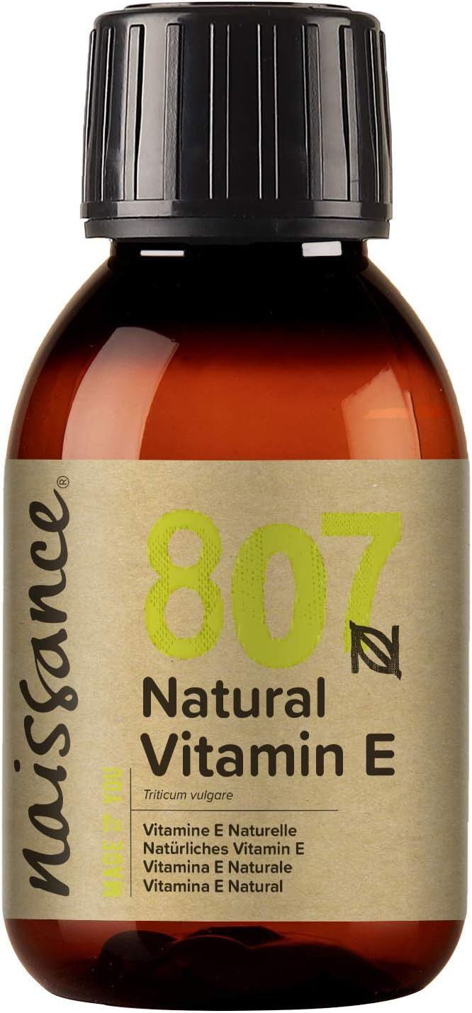 Braune Glasflasche mit schwarzem Deckel. Etikett mit gelber Schrift: 807 Natural Vitamin E. Marke: Naissance.