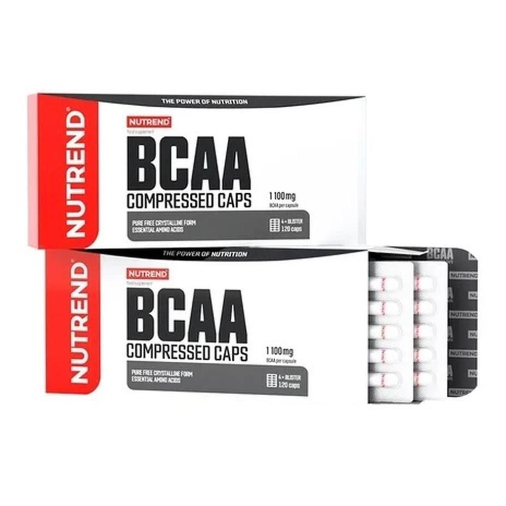 Zwei Schachteln mit Kapseln. Aufschrift: BCAA Compressed Caps. Eine Schachtel ist geöffnet und zeigt Blisterpackungen mit Kapseln.
