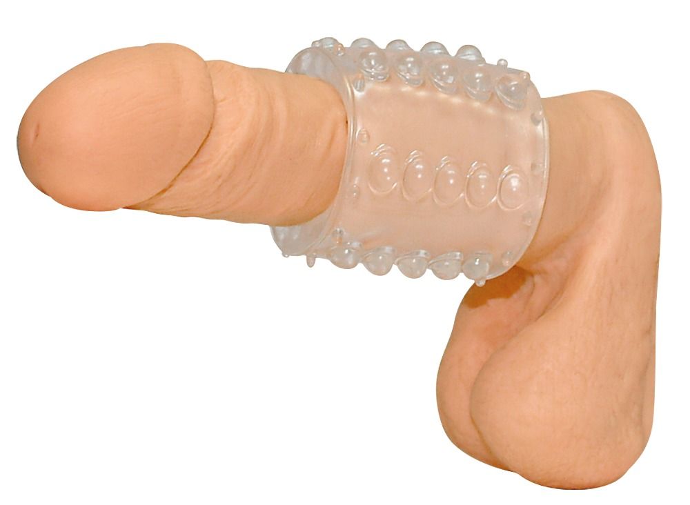 Transparenter Ring mit Noppen, um einen Penis gelegt. Material: transparentes Kunststoff.