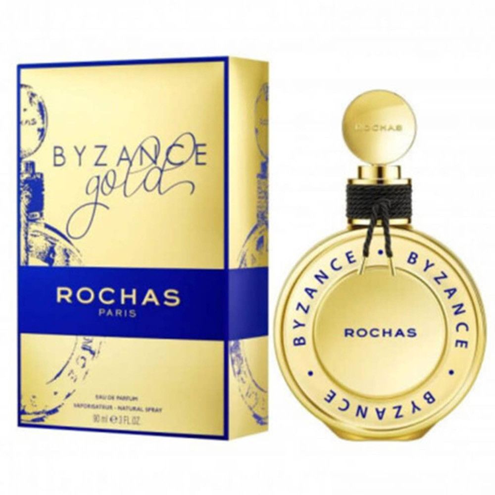 Goldene Schachtel und Flakon. Aufschrift: BYZANCE Gold, ROCHAS PARIS. Flakon mit schwarzem Band.