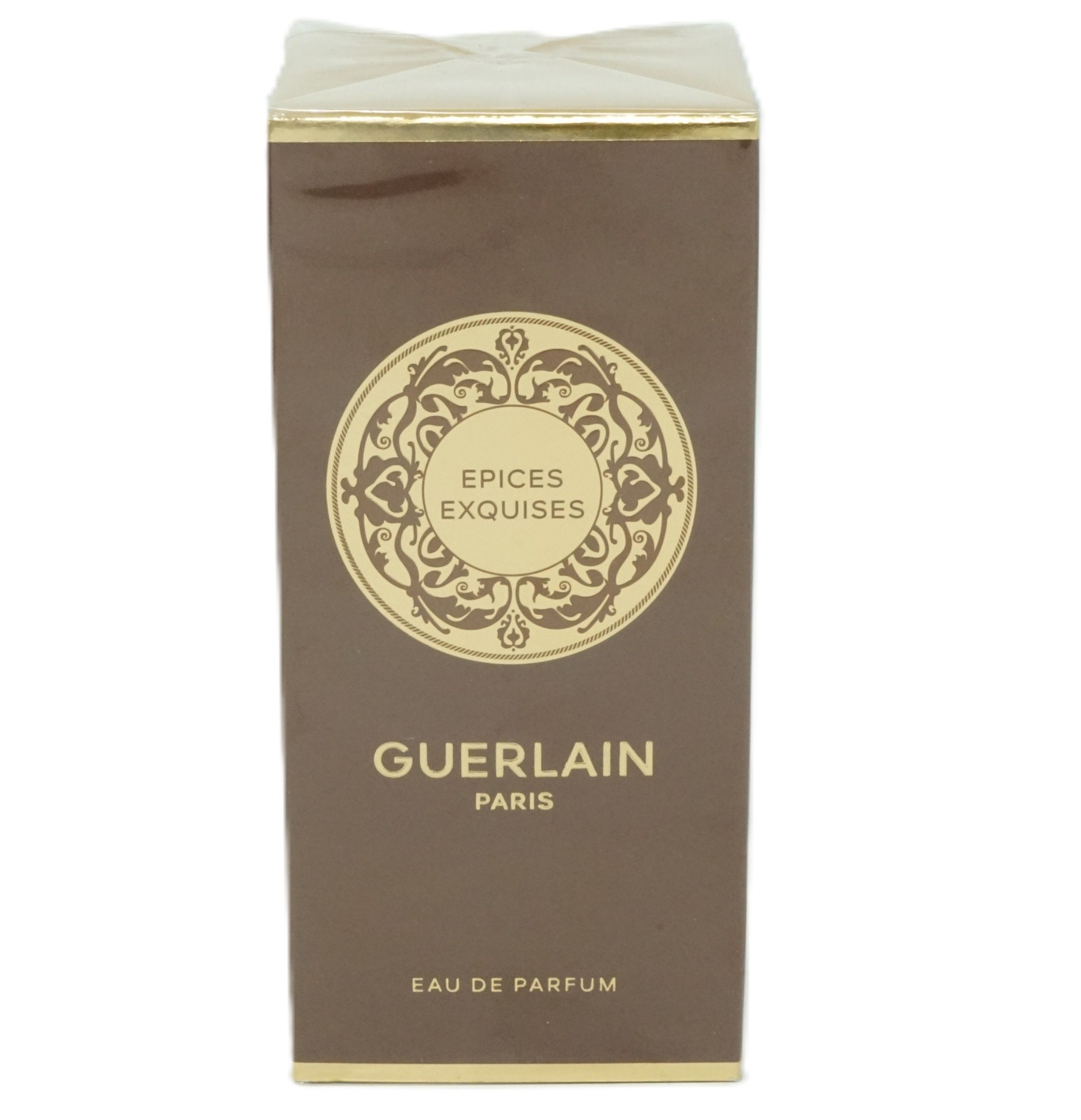 Braune rechteckige Schachtel mit goldenem Etikett. Aufschrift: Épices Exquises Guerlain Paris.