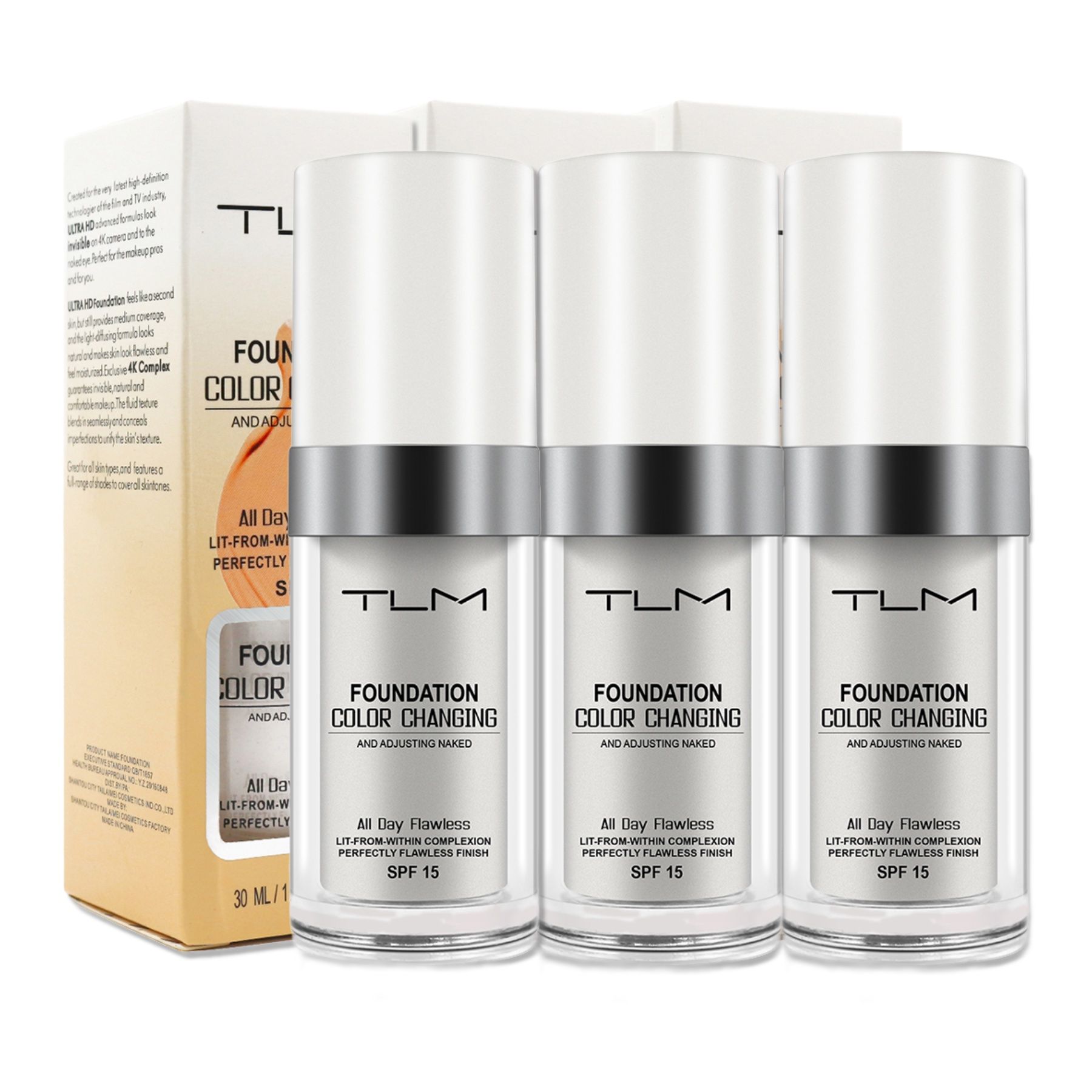 Drei Flaschen Foundation mit weißem Deckel und silbernem Ring. Aufschrift: Foundation Color Changing, SPF 15.