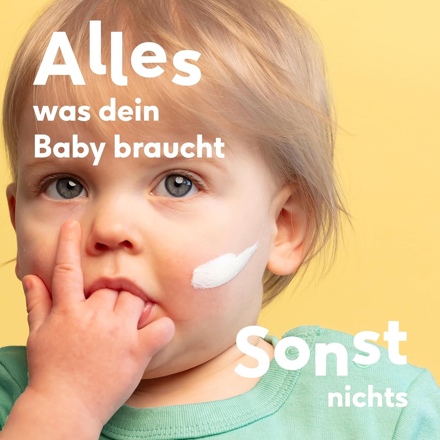 Kleinkind mit Creme im Gesicht. Text: Alles was dein Baby braucht, sonst nichts.