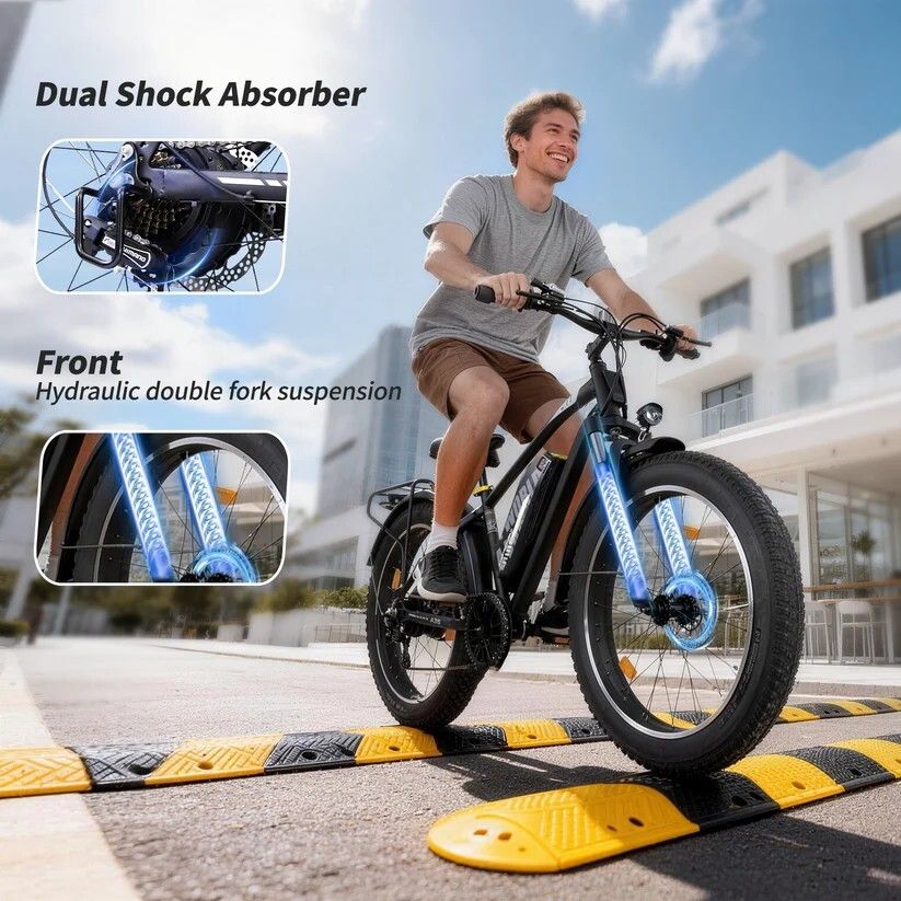 Person fährt E-Bike. Doppel-Stoßdämpfer, hydraulische Federung. Szenen: Straße, Bordsteine. Blaue Akzentbeleuchtung.