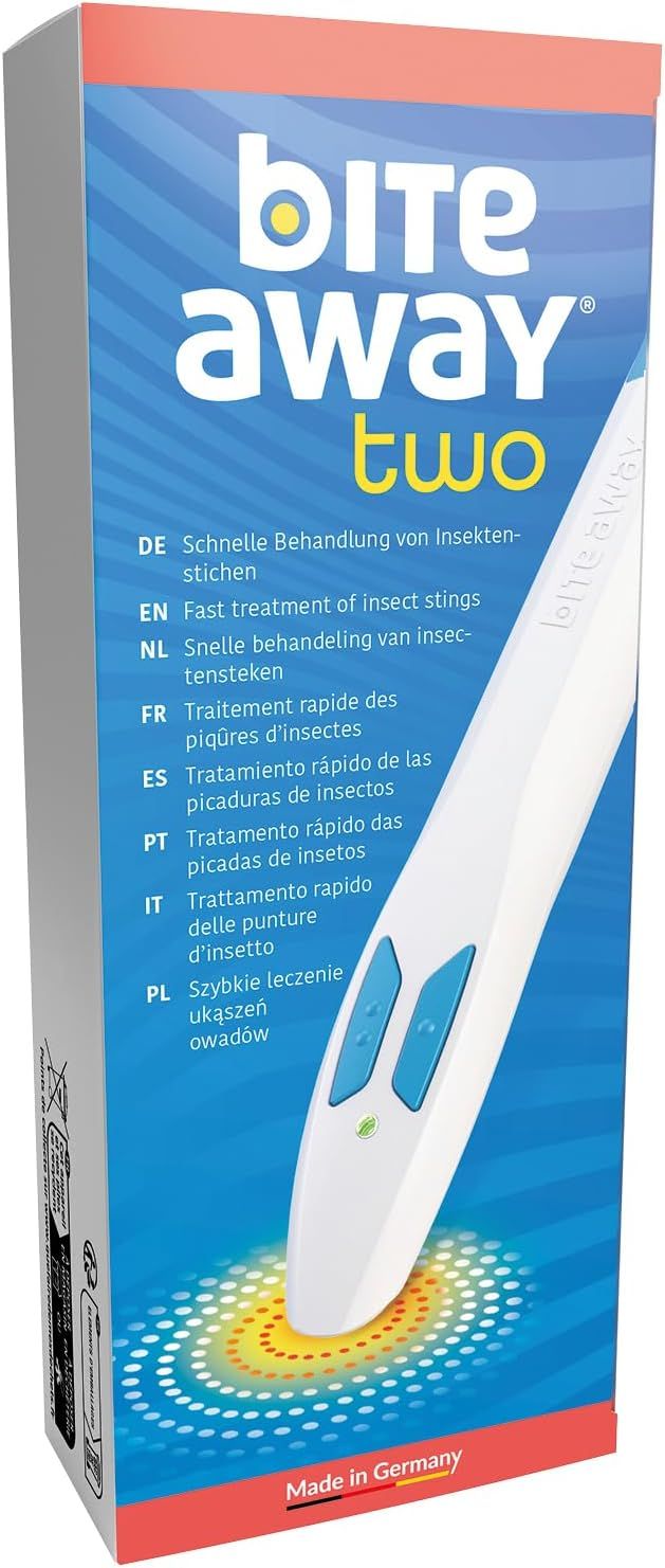 Verpackung von bite away two. Text in mehreren Sprachen. Weißes Gerät mit blauen Knöpfen und Spitze, auf Verpackung.