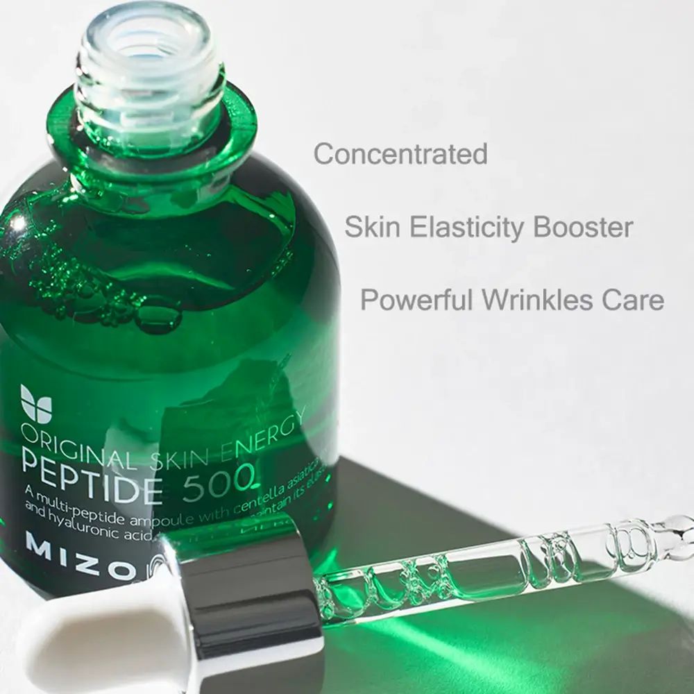 Grüne Glasflasche mit Pipette. Aufschrift: ORIGINAL SKIN ENERGY PEPTIDE 500, MIZON. Zusätzliche Text: Concentrated, Skin Elasticity Booster, Powerful Wrinkles Care.