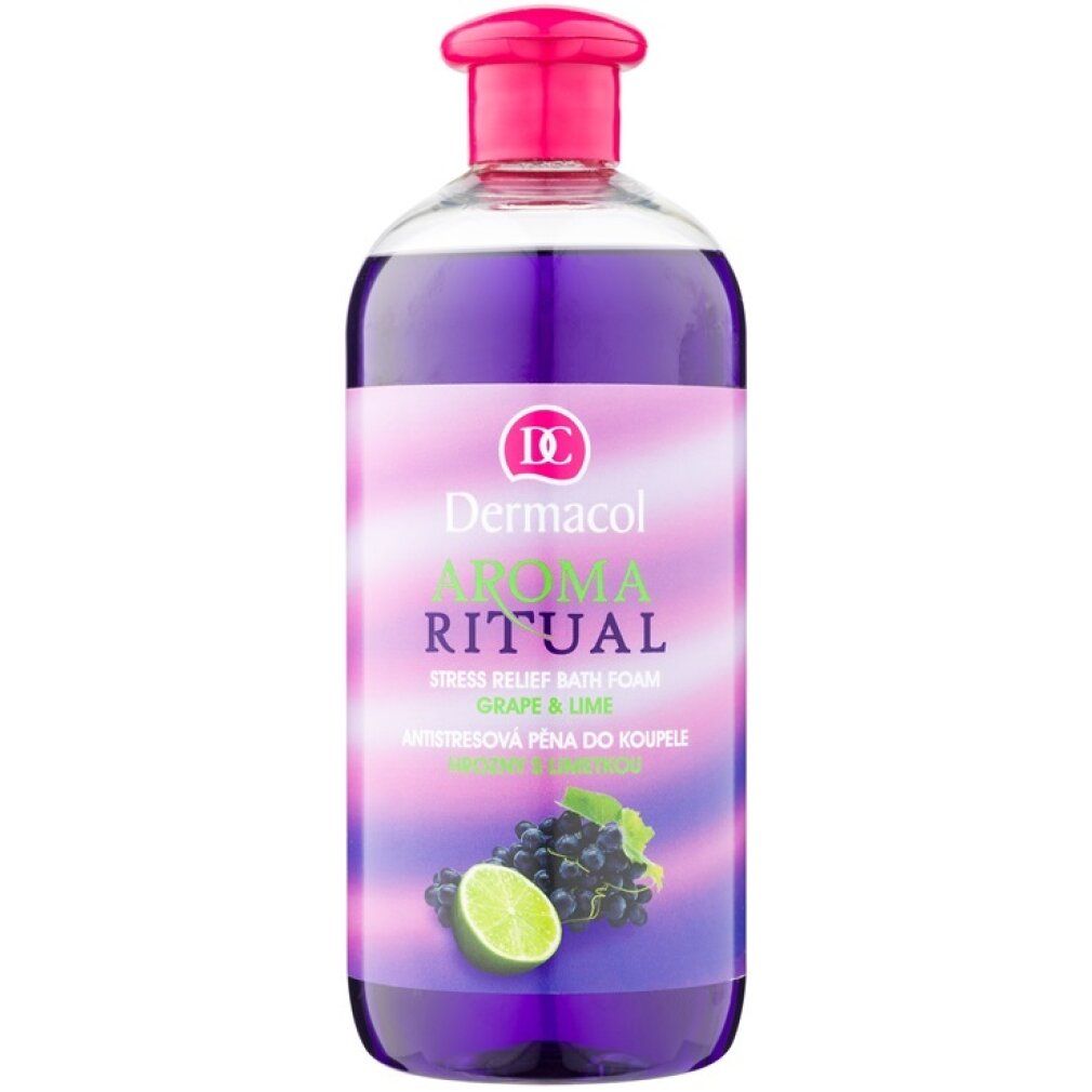 Flasche mit Dermacol Aroma Ritual Badezusatz. Rosa Deckel, lila Flüssigkeit, Etikett mit Trauben und Limette.