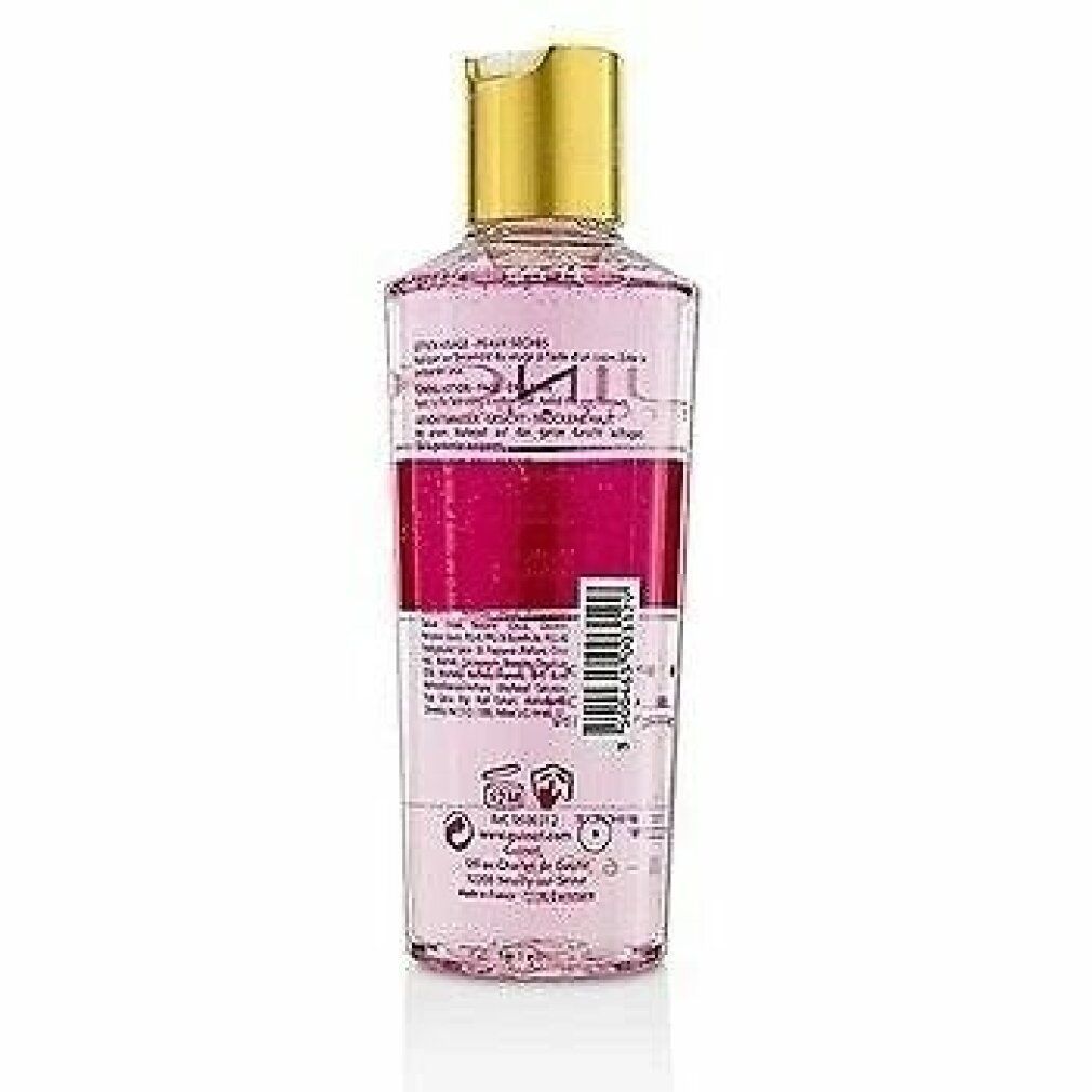 Guinot Hydra Beaute Lotion. Rückseite der Flasche. Transparente Flasche mit rosafarbener Flüssigkeit. Etikett mit Text.