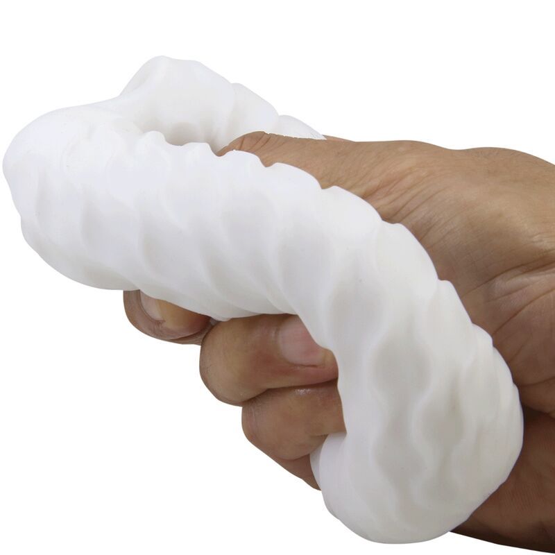 Weißes, längliches Produkt mit wellenförmiger Oberfläche, in einer Hand gehalten.