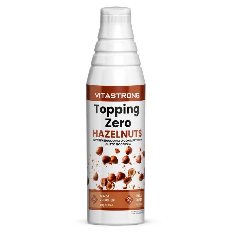 Flasche Topping Zero Hazelnuts. Text: Zuckerfrei, fettfrei. Abgebildet sind Haselnüsse.