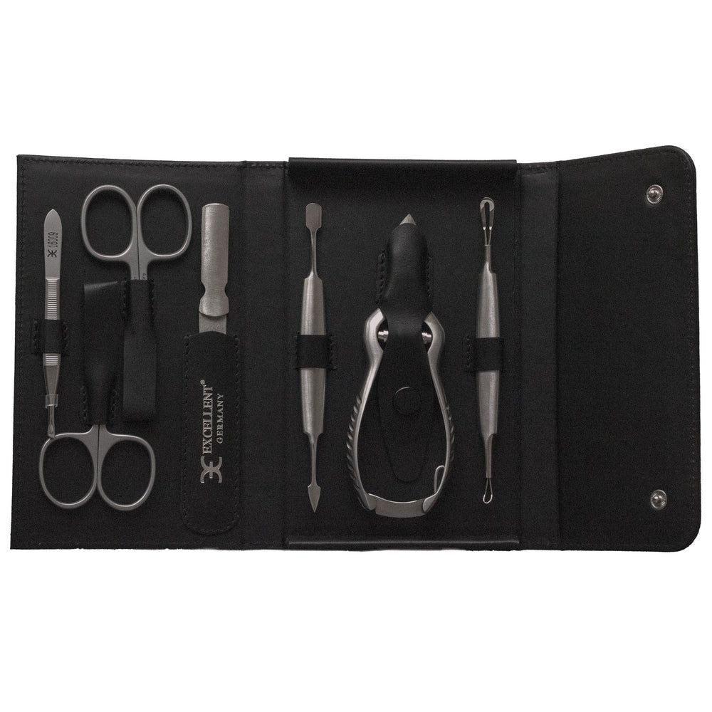 7-teiliges Maniküre-Etui aus schwarzem Leder mit Schere, Nagelknipser und Pinzette.