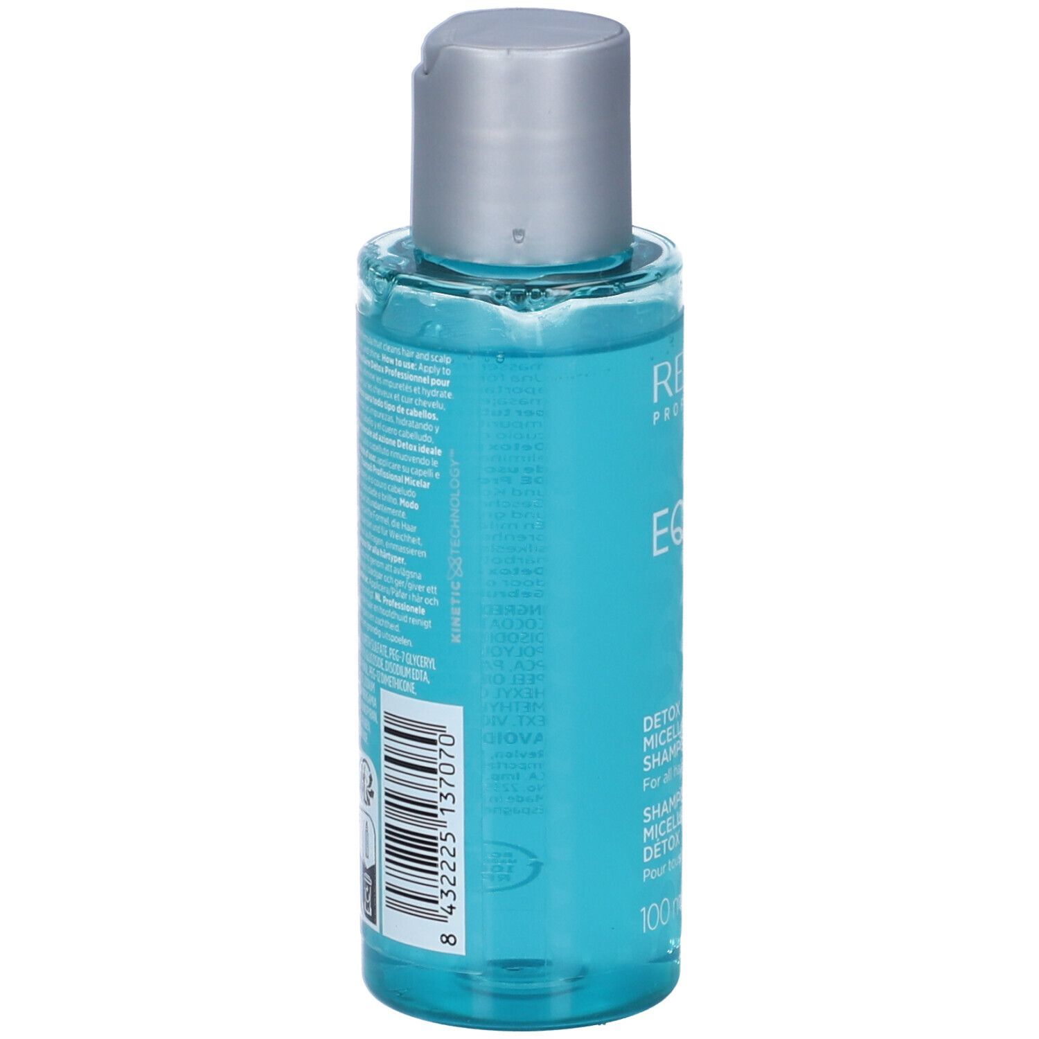 Transparente Flasche mit blauem Shampoo. Silberner Deckel. Produktetikett mit Text und Barcode.