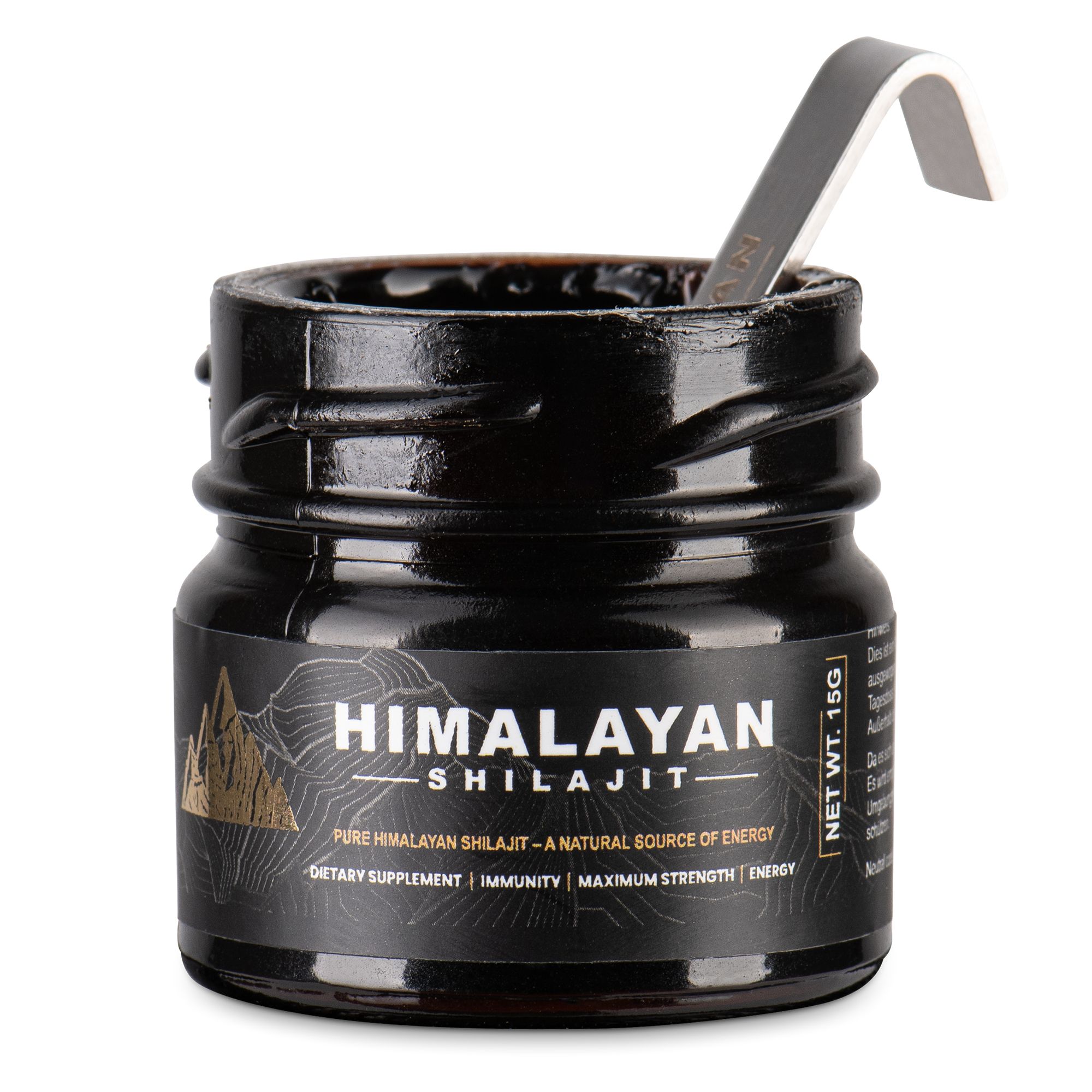 Glasbehälter mit schwarzem Inhalt, geöffnet. Löffel steckt im Behälter. Etikett mit "Himalayan Shilajit".