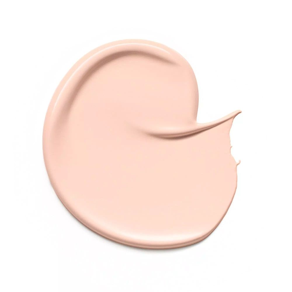 Beiger Concealer-Fleck auf weißem Hintergrund. Cremige Textur.