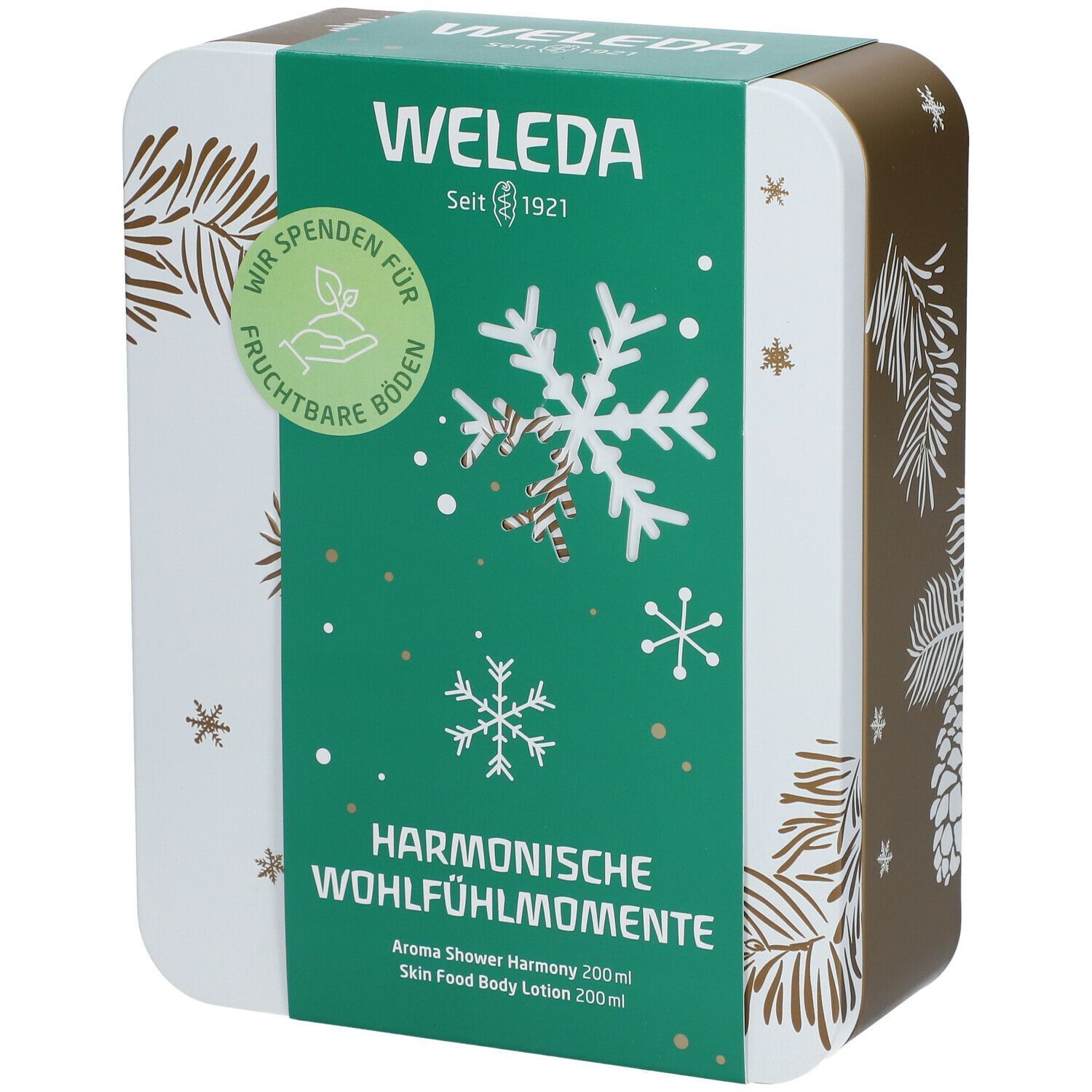 Geschenkset-Box mit grünem Deckel. Aufschrift: Weleda, Harmonische Wohlfühlmomente. Schneeflocken-Design. Seit 1921.