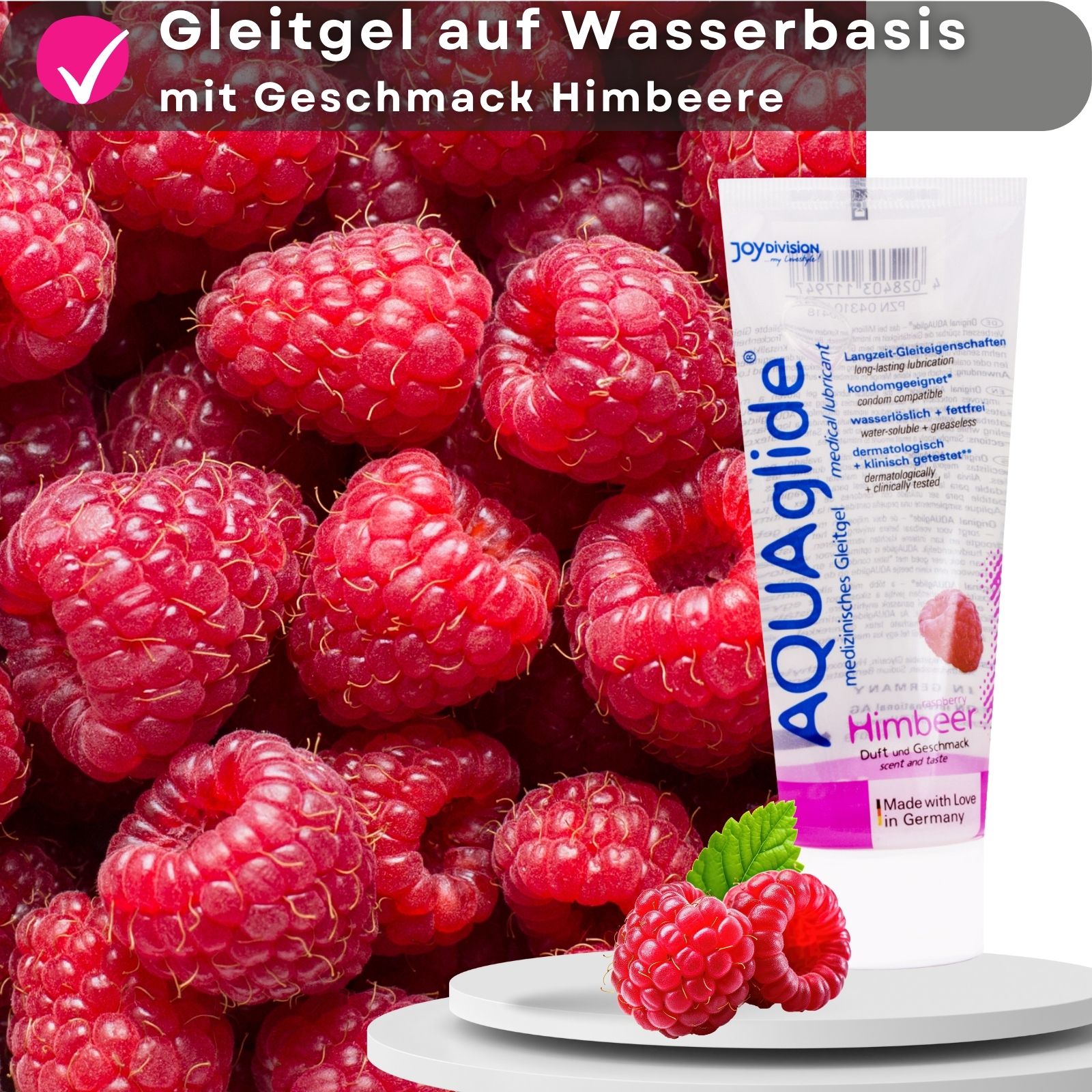 AQUAglide Gleitgel Himbeere Tube. Himbeeren im Hintergrund. Text: Gleitgel auf Wasserbasis, mit Geschmack Himbeere.
