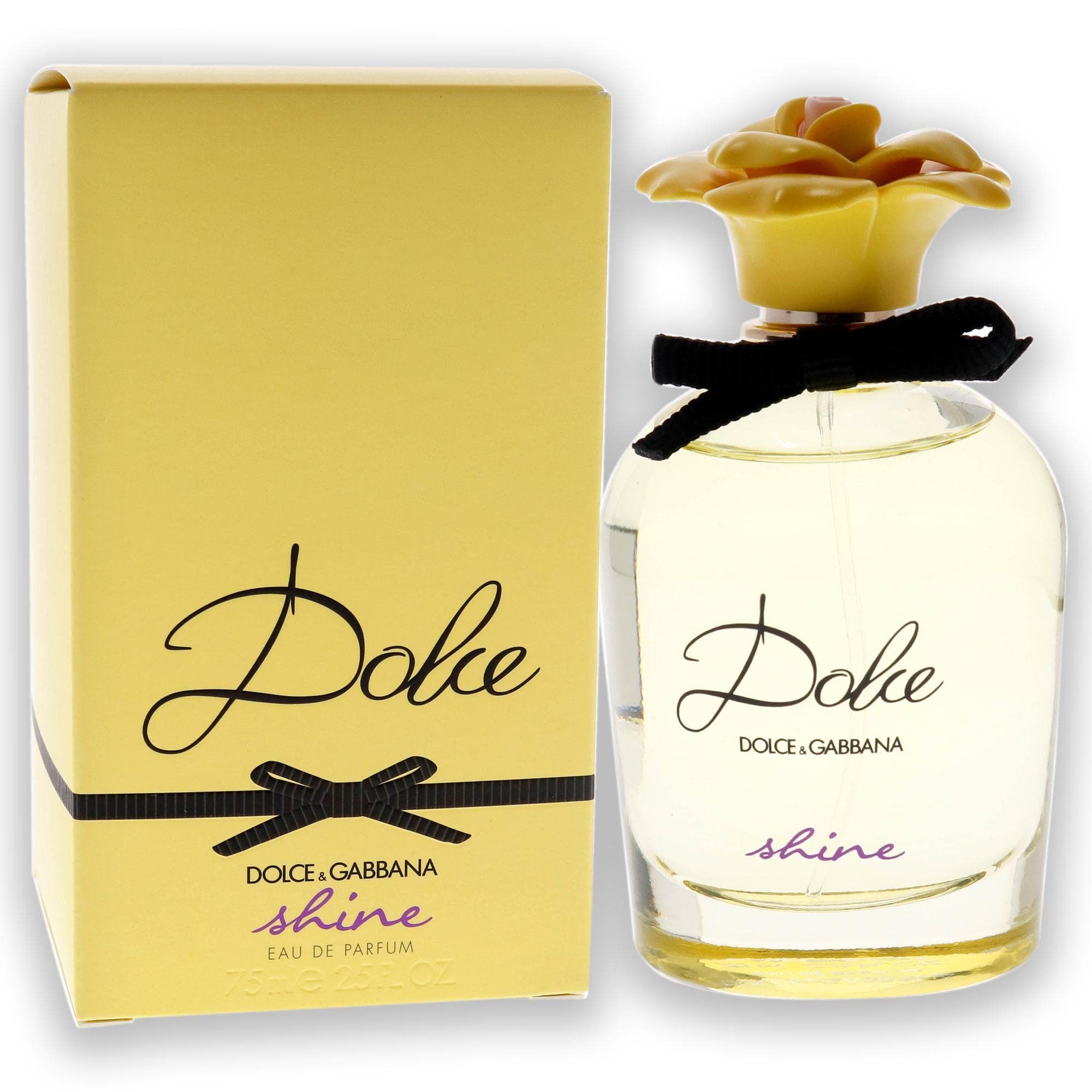 Parfümflakon und Verpackung. Gelbe Verpackung mit schwarzer Schleife und Aufschrift "Dolce & Gabbana Dolce shine".