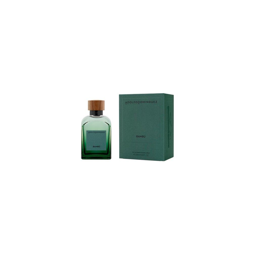 Grüne Glasflasche mit Holzdeckel und grüner Verpackung. Auf der Flasche steht "Bambú". Die Verpackung trägt den Namen "ADOLFO DOMINGUEZ".