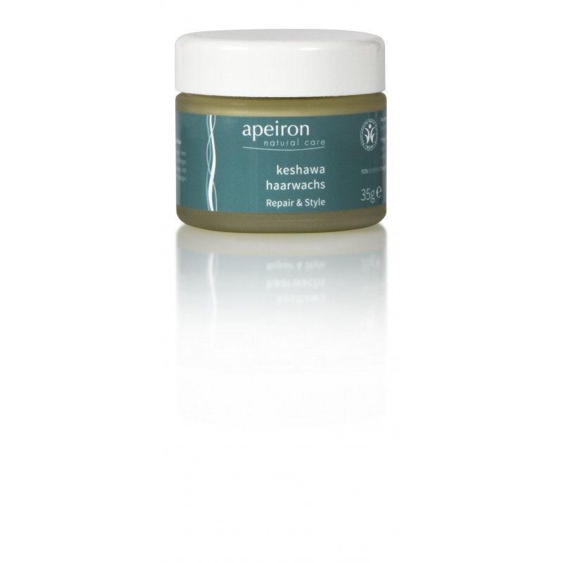 Tiegel mit Haarwachs. Aufschrift: Apeiron, keshawa Haarwachs, Repair & Style. Wei
ßer Deckel, gr
üne Etikette.