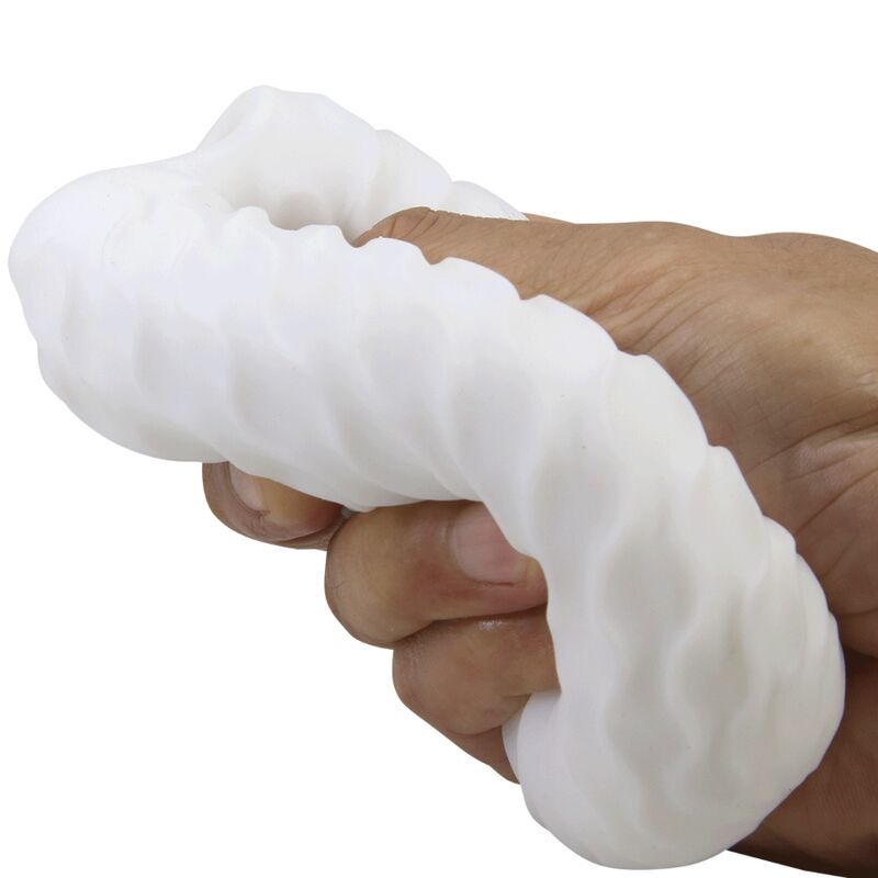 Weißes, längliches Produkt mit wellenförmiger Oberfläche, in einer Hand gehalten.