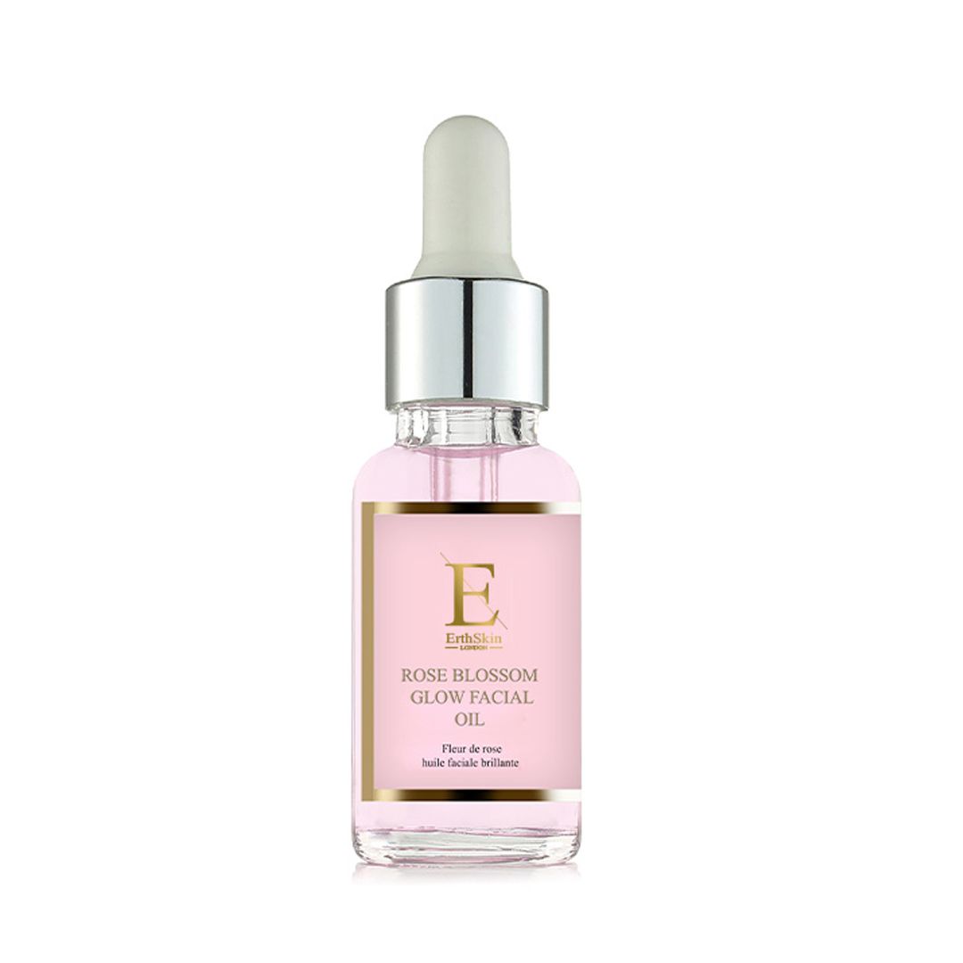 Glasflasche mit Pipette, gefüllt mit rosafarbenem Gesichtsöl. Etikett mit 'Rose Blossom Glow Facial Oil'.