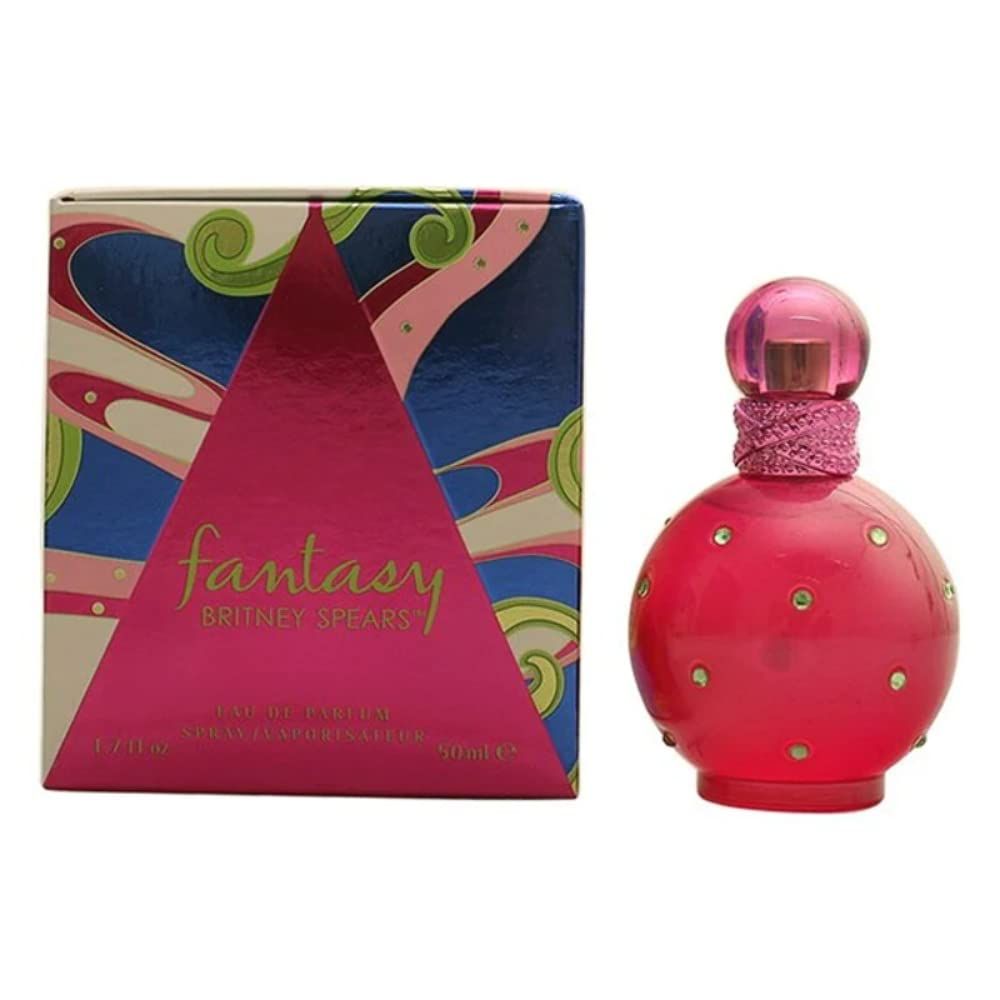 Pinkfarbener Flakon und Verpackung. Flakon rund mit Strasssteinen. Verpackung mit pinkem Dreieck und Schriftzug.