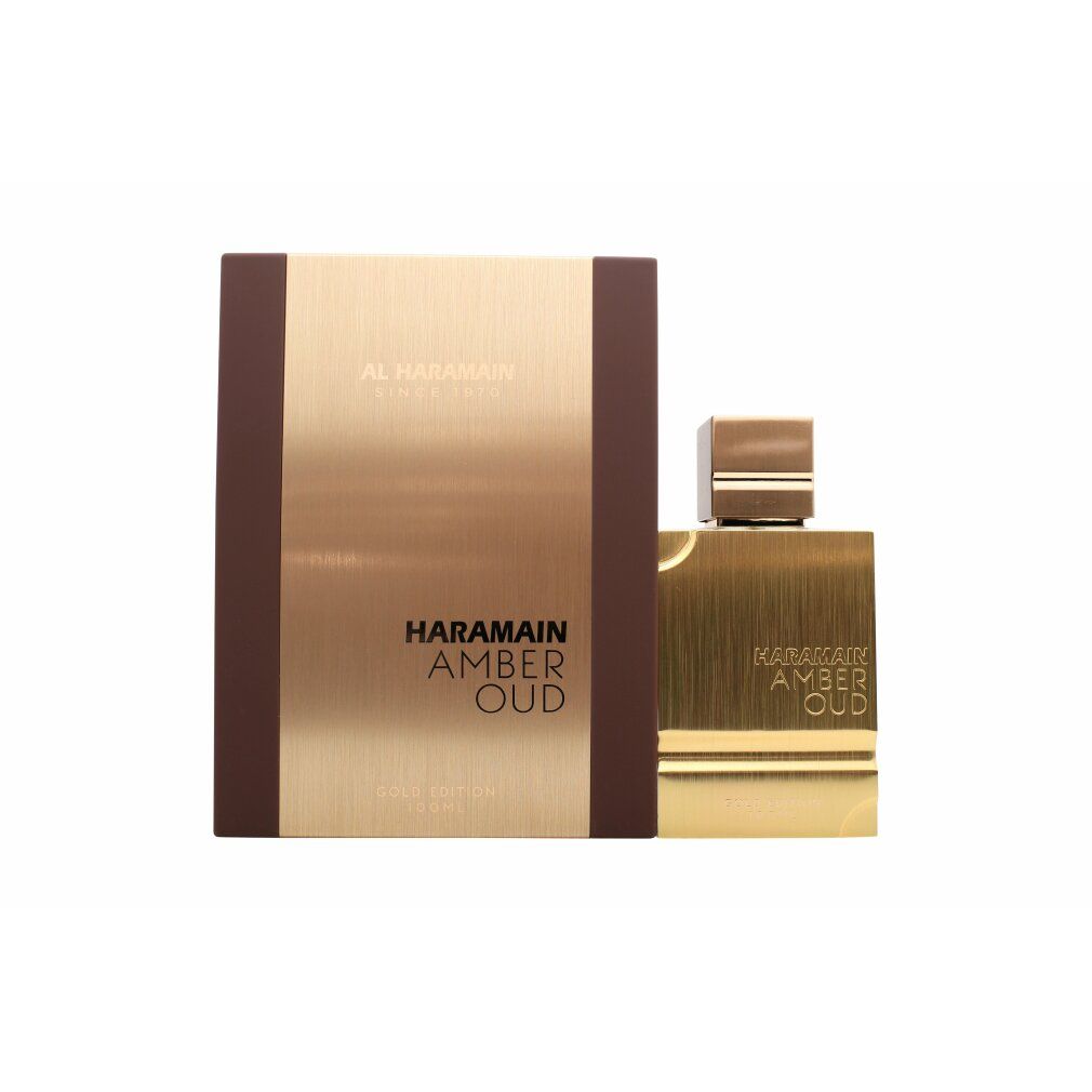 Goldfarbener Flakon und Verpackung. Aufschrift: HARAMAIN AMBER OUD. Braune Verpackung mit goldfarbener Front. Flakon mit goldfarbenem Deckel.