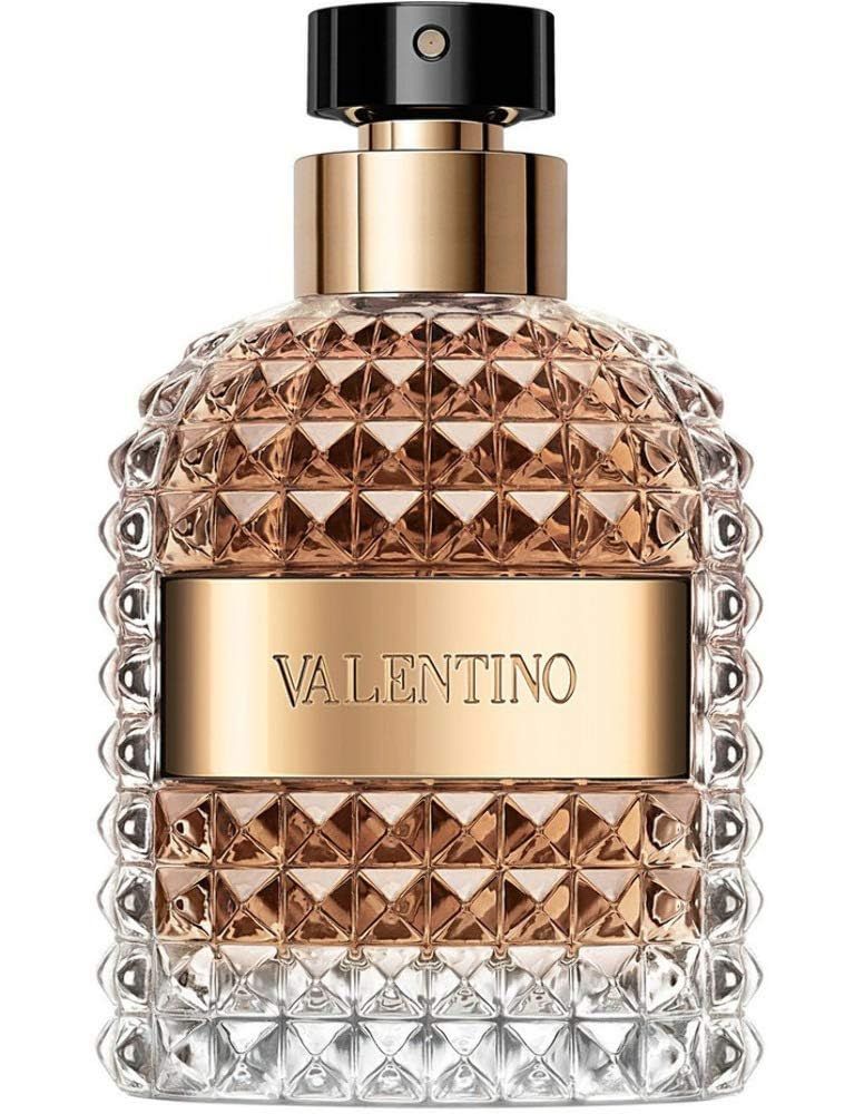 Parfümflakon mit goldfarbenen Elementen und geprägtem Glas. Aufschrift Valentino. Auf weißem Hintergrund.