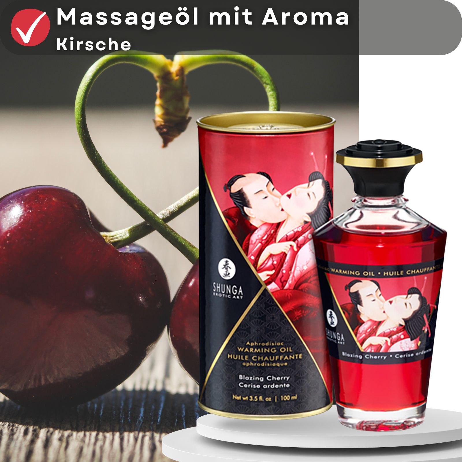 Kirschen und Massageöl-Flasche mit Verpackung. Aufschrift: Massageöl mit Aroma Kirsche, Shunga, Warming Oil, Blazing Cherry. Abbildung: küssendes Paar.