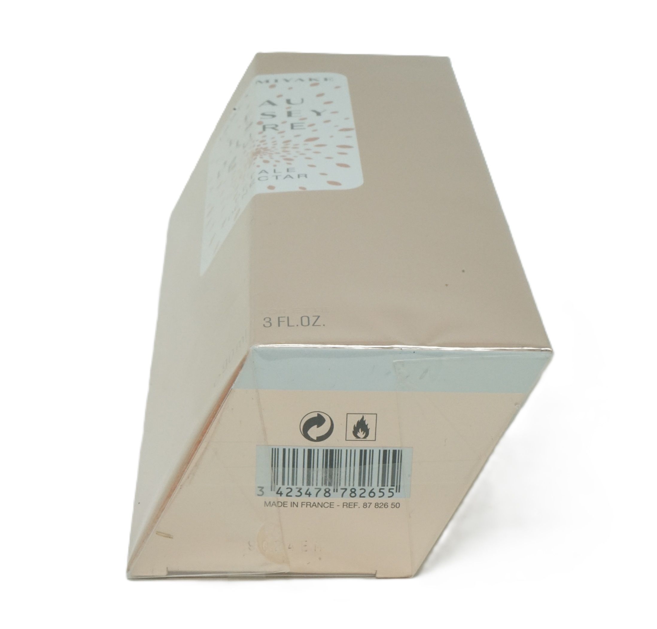 Schräg gestellte, beige Kartonverpackung. Aufdruck mit Barcode, Warnsymbolen und "3 FL.OZ.".