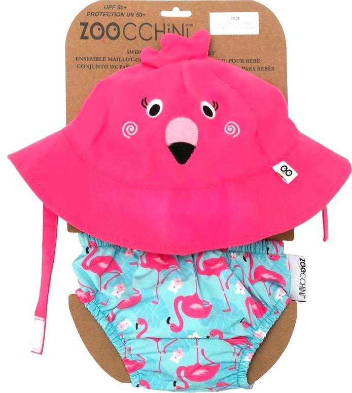 Set aus rosa Sonnenhut und Badewindel mit Flamingos. Der Hut hat ein Flamingo-Gesicht. Die Windel hat einen Flamingo-Print. Marke: ZOOCCHINI.