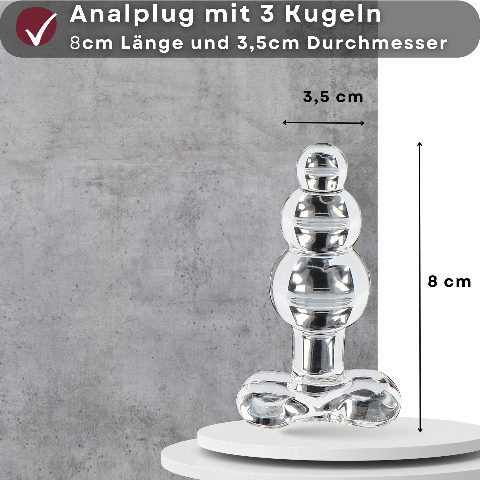 Analplug mit 3 Kugeln, 8 cm lang, 3,5 cm Durchmesser. Transparentes Glas, gerippte Oberfläche.