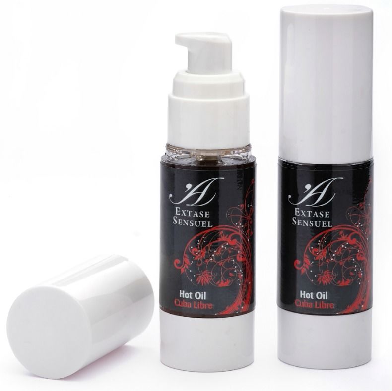 Zwei Flaschen Extase Sensuel Hot Oil mit Pumpspender. Eine Kappe liegt daneben.