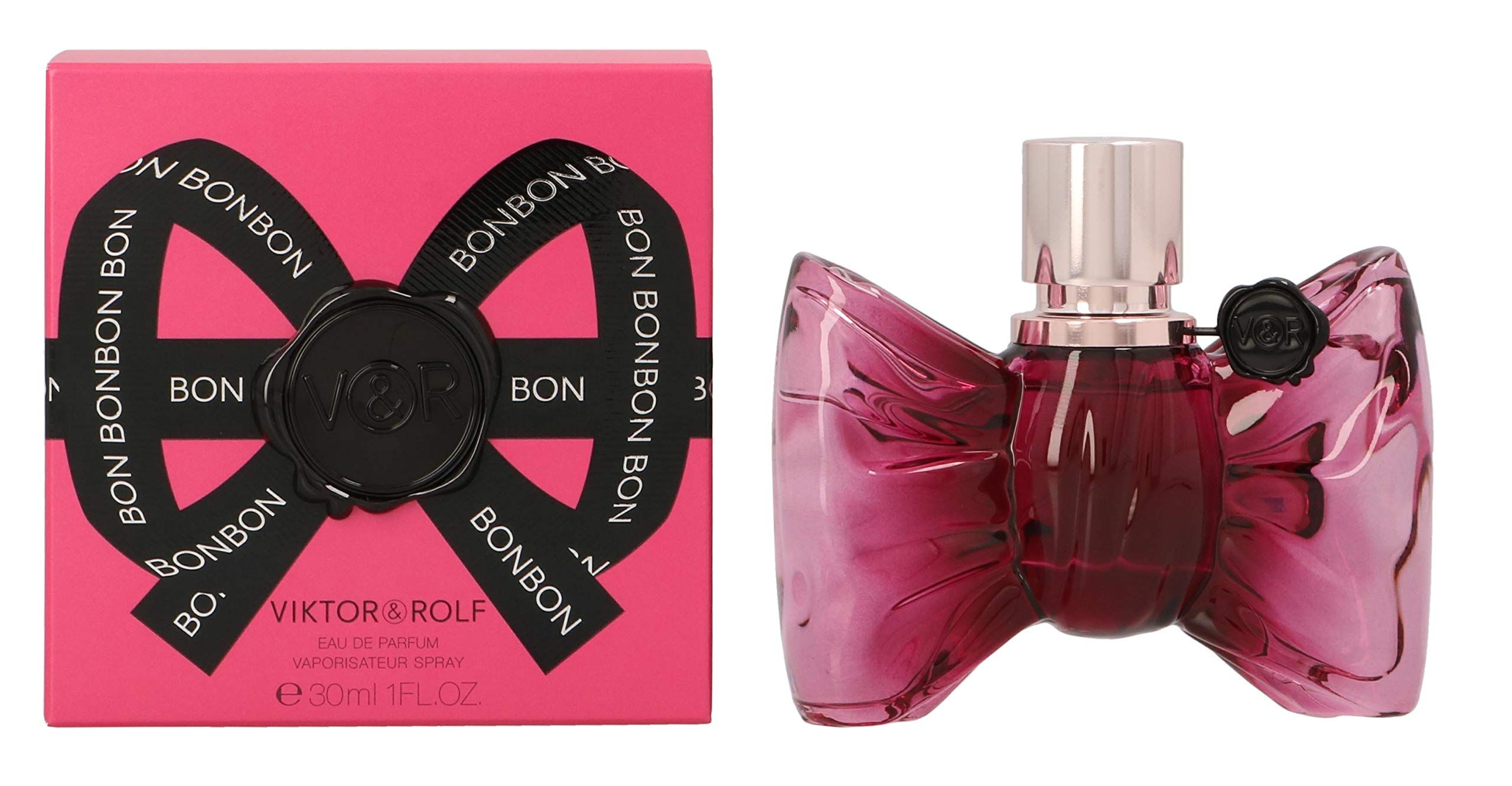 Rosa Schachtel mit schwarzer Schleife und Schriftzug BONBON. Daneben eine rosa Flasche in Schleifenform.