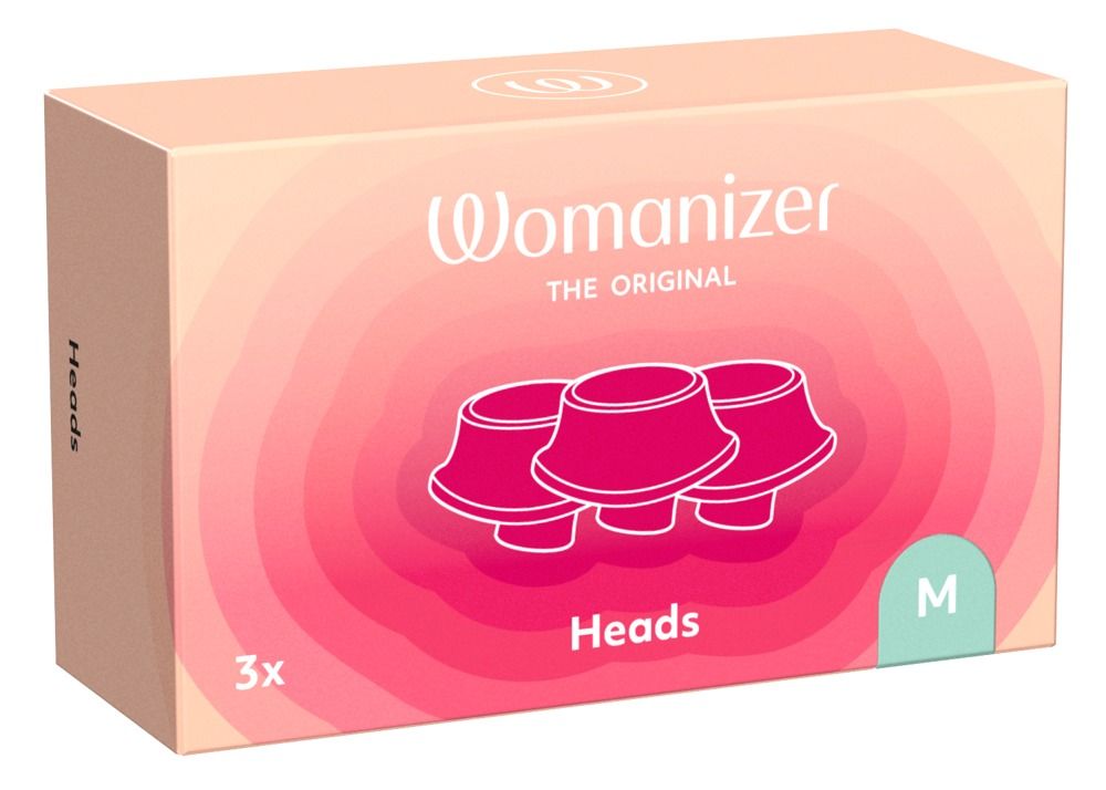 Verpackung mit Ersatzköpfen. Aufschrift: Womanizer, Heads, 3x, M. Rosa-weißer Hintergrund.