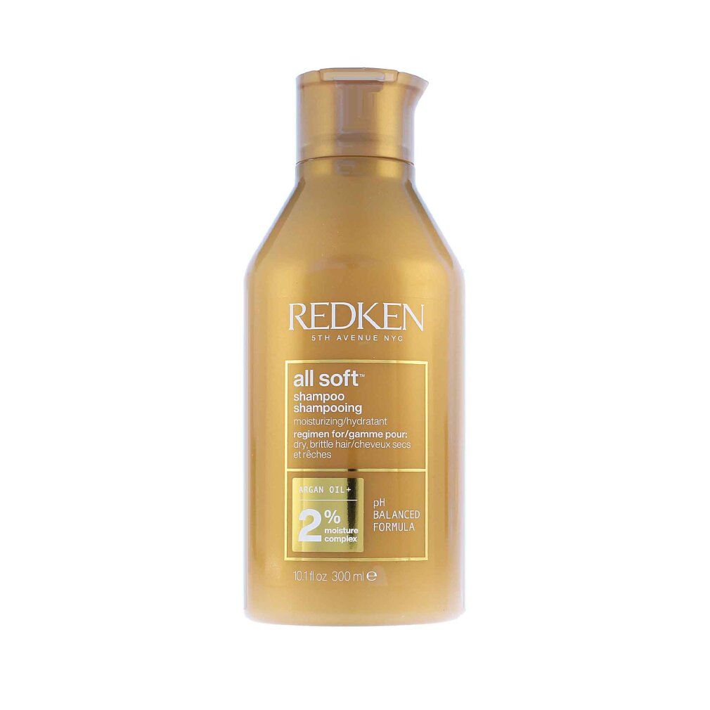Goldfarbene Shampoo-Flasche mit "Redken" und "all soft". Enthält Arganöl und 2% Feuchtigkeitskomplex. pH-ausgeglichene Formel.