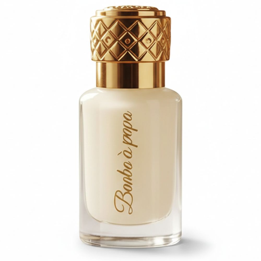 Cremefarbener Flakon mit goldener Kappe und Schriftzug Bonbon à papa. Klarer Glasflakon.